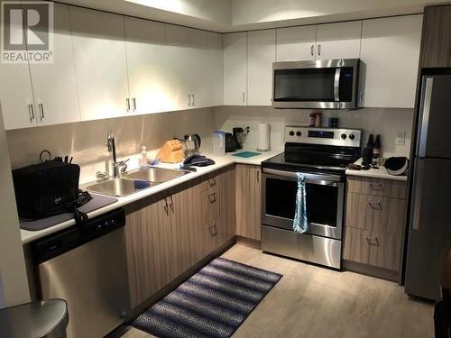 655 Academy Way Unit# 217, Kelowna, BC - Indoor Photo Showing Kitchen With Stainless Steel Kitchen With Double Sink