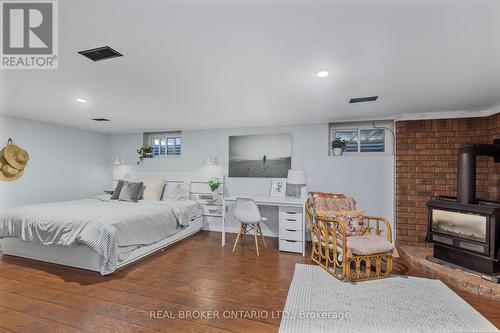 101 Queen Street, Barrie, ON - Indoor Photo Showing Bedroom With Fireplace