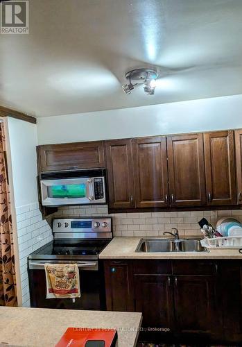 209 - 180 Markham Road, Toronto, ON - Indoor Photo Showing Kitchen With Double Sink