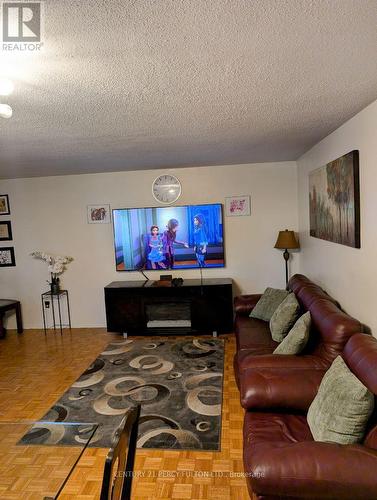 209 - 180 Markham Road, Toronto, ON - Indoor Photo Showing Living Room