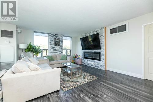 522 - 6 Humberline Drive, Toronto, ON - Indoor Photo Showing Living Room With Fireplace