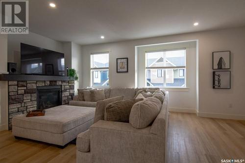 214 3220 11Th Street W, Saskatoon, SK - Indoor Photo Showing Living Room With Fireplace