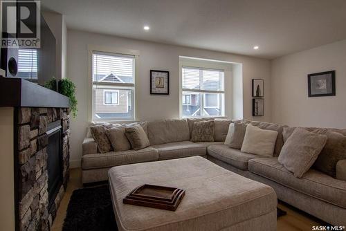 214 3220 11Th Street W, Saskatoon, SK - Indoor Photo Showing Living Room With Fireplace