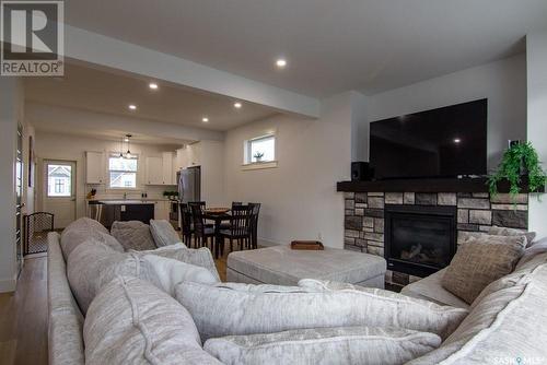 214 3220 11Th Street W, Saskatoon, SK - Indoor Photo Showing Living Room With Fireplace