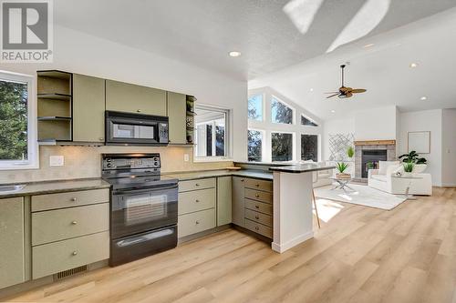 10541 Westshore Road, Vernon, BC - Indoor Photo Showing Kitchen With Fireplace