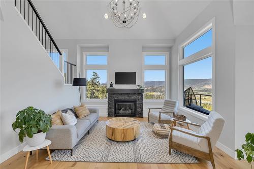 121 Upper Canyon Drive, Kelowna, BC - Indoor Photo Showing Living Room With Fireplace