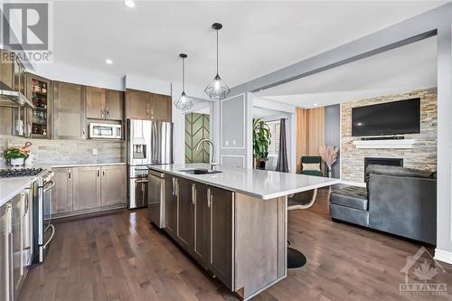 213 Enclave Walk, Ottawa, ON - Indoor Photo Showing Kitchen With Fireplace With Upgraded Kitchen