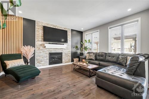 213 Enclave Walk, Ottawa, ON - Indoor Photo Showing Living Room With Fireplace