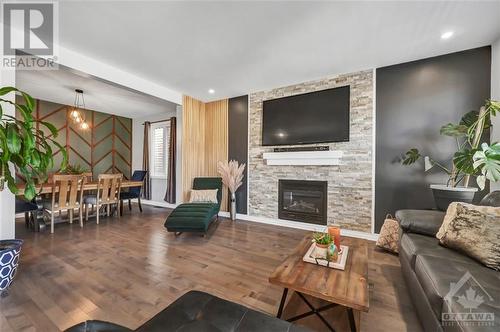 213 Enclave Walk, Ottawa, ON - Indoor Photo Showing Living Room With Fireplace