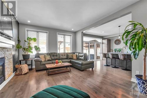 213 Enclave Walk, Ottawa, ON - Indoor Photo Showing Living Room With Fireplace