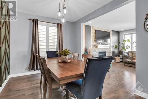 213 Enclave Walk, Ottawa, ON - Indoor Photo Showing Dining Room With Fireplace