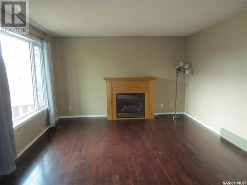 71 Patricia Drive, Coronach, SK - Indoor Photo Showing Other Room With Fireplace