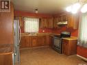 71 Patricia Drive, Coronach, SK  - Indoor Photo Showing Kitchen With Double Sink 