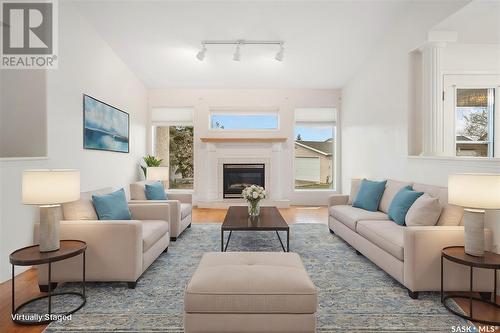 233 Mckay Court, Warman, SK - Indoor Photo Showing Living Room With Fireplace