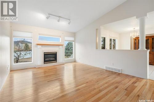 233 Mckay Court, Warman, SK - Indoor Photo Showing Living Room With Fireplace