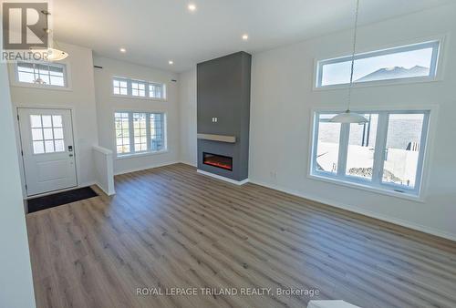 54 Snowy Owl Trail, Central Elgin, ON - Indoor Photo Showing Other Room With Fireplace