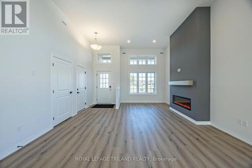 54 Snowy Owl Trail, Central Elgin, ON - Indoor Photo Showing Other Room With Fireplace