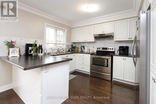 67 - 2178 Fiddlers Way, Oakville, ON - Indoor Photo Showing Kitchen With Stainless Steel Kitchen With Double Sink