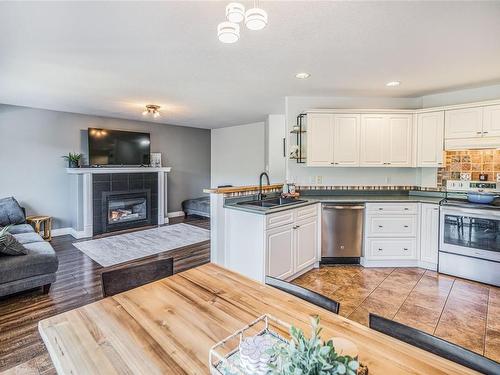 5790 Brookwood Dr, Nanaimo, BC - Indoor Photo Showing Kitchen With Fireplace