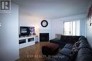 324 - 1500 Pilgrims Way, Oakville, ON  - Indoor Photo Showing Living Room With Fireplace 