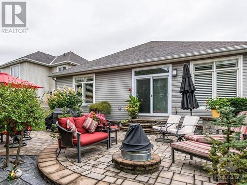 The backyard oasis – great spot to lounge and read, have bbqs, host gatherings, and enjoy the lights at night - 322 Tucana Way, Ottawa, ON - Outdoor With Deck Patio Veranda