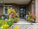 You will love the front porch... lounging, reading, chatting with the neighbours, watching the birds up close in the bird feeders on the tree in front of the porch - 322 Tucana Way, Ottawa, ON  - Outdoor 