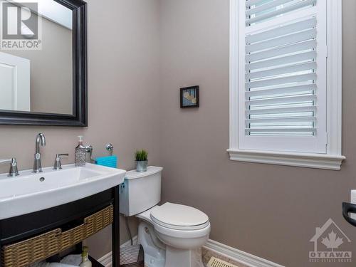 Upgraded fixtures and a taller toilet plus you will enjoy the storage space under the sink. - 322 Tucana Way, Ottawa, ON - Indoor Photo Showing Bathroom