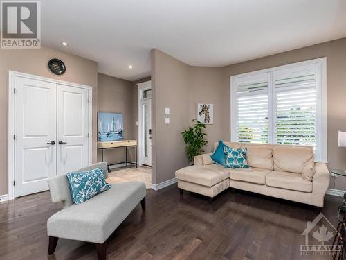 Living room is perfect for a quiet place to read a book and sit by the fire on a cold winter day. - 322 Tucana Way, Ottawa, ON - Indoor Photo Showing Living Room