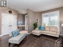 Living room is perfect for a quiet place to read a book and sit by the fire on a cold winter day. - 322 Tucana Way, Ottawa, ON  - Indoor Photo Showing Living Room 