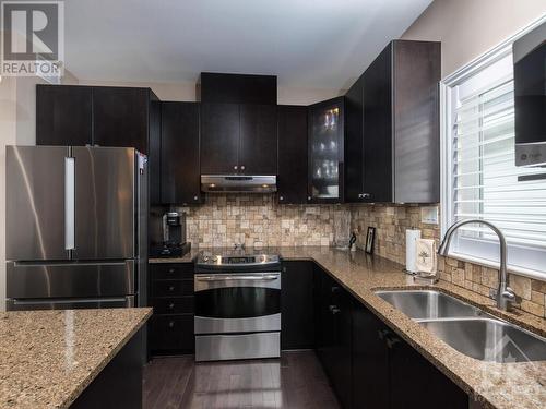 Lots of cupboard and counter space.  And when you book a showing, you can see the double tall pantry cupboards. - 322 Tucana Way, Ottawa, ON - Indoor Photo Showing Kitchen With Double Sink With Upgraded Kitchen