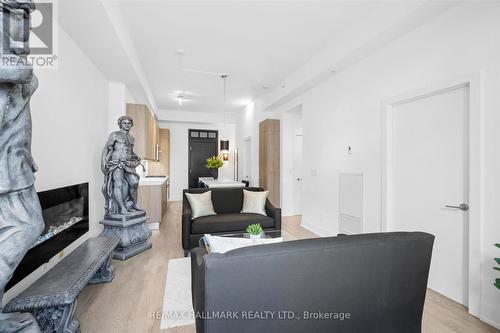 203 - 66 Kippendavie Avenue, Toronto, ON - Indoor Photo Showing Living Room With Fireplace