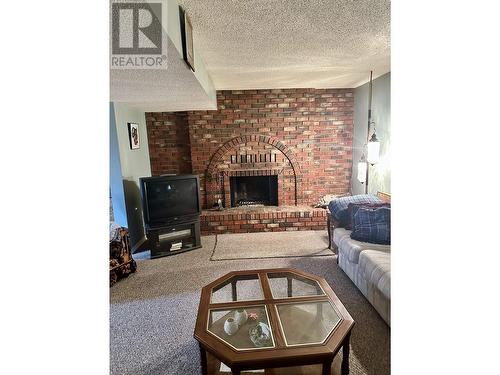 6099 Montgomery Crescent, Prince George, BC - Indoor Photo Showing Living Room With Fireplace