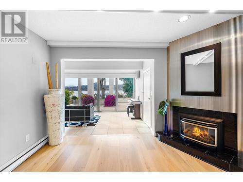 2900 Abbott Street Unit# 208, Kelowna, BC - Indoor Photo Showing Living Room With Fireplace