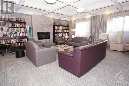 Library - 1195 Richmond Road Unit#1507, Ottawa, ON - Indoor Photo Showing Living Room With Fireplace