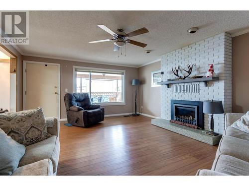 450 Hollywood Road S, Kelowna, BC - Indoor Photo Showing Living Room With Fireplace