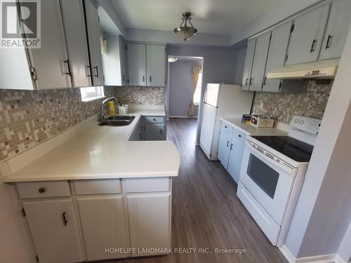 Upper - 16 Nortonville Drive, Toronto, ON - Indoor Photo Showing Kitchen With Double Sink