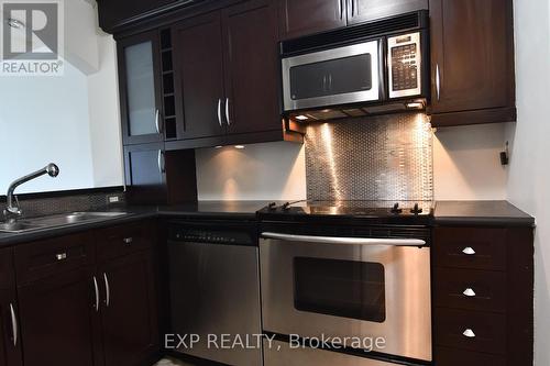 609 - 140 Dunlop Street E, Barrie, ON - Indoor Photo Showing Kitchen With Double Sink