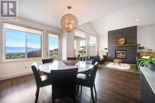 1459 Rocky Point Drive, Kelowna, BC - Indoor Photo Showing Dining Room With Fireplace