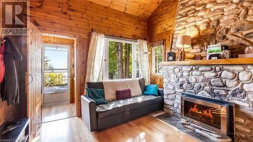 1081 Dyers Bay Road, Northern Bruce Peninsula, ON - Indoor Photo Showing Living Room With Fireplace