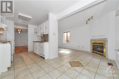 14 Ashpark Crescent, Ottawa, ON - Indoor Photo Showing Kitchen With Fireplace