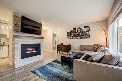 103-4305 Bellevue Drive, Vernon, BC - Indoor Photo Showing Living Room With Fireplace