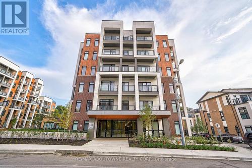 204 - 135 Canon Jackson Drive, Toronto, ON - Outdoor With Balcony With Facade