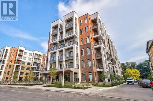 204 - 135 Canon Jackson Drive, Toronto, ON - Outdoor With Balcony With Facade