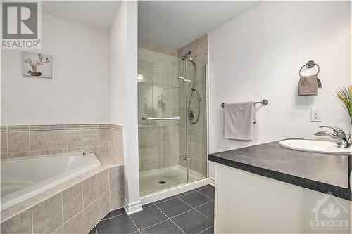 Primary bedroom with a spa-like ensuite featuring a corner tub. - 445 Barrick Hill Road, Ottawa, ON - Indoor Photo Showing Bathroom