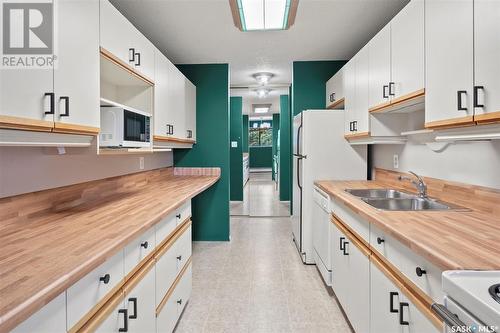 319 209B Cree Place, Saskatoon, SK - Indoor Photo Showing Kitchen With Double Sink