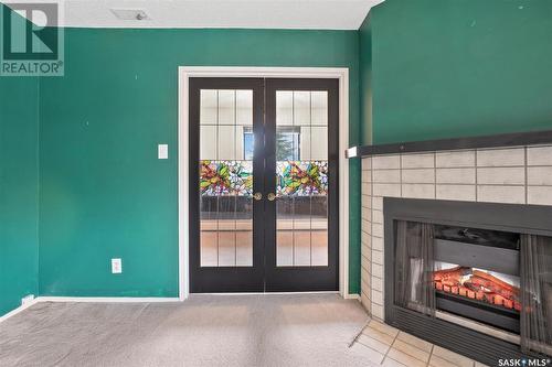 319 209B Cree Place, Saskatoon, SK - Indoor With Fireplace