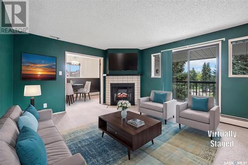 319 209B Cree Place, Saskatoon, SK - Indoor Photo Showing Living Room With Fireplace