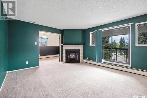 319 209B Cree Place, Saskatoon, SK - Indoor With Fireplace