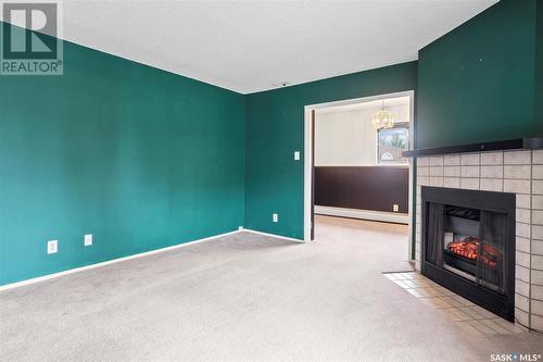 319 209B Cree Place, Saskatoon, SK - Indoor With Fireplace