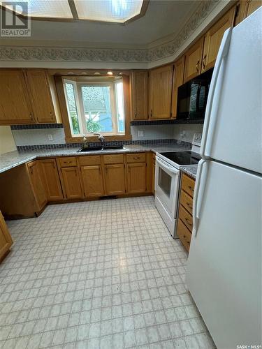 532 Simpson Crescent, Hudson Bay, SK - Indoor Photo Showing Kitchen With Double Sink